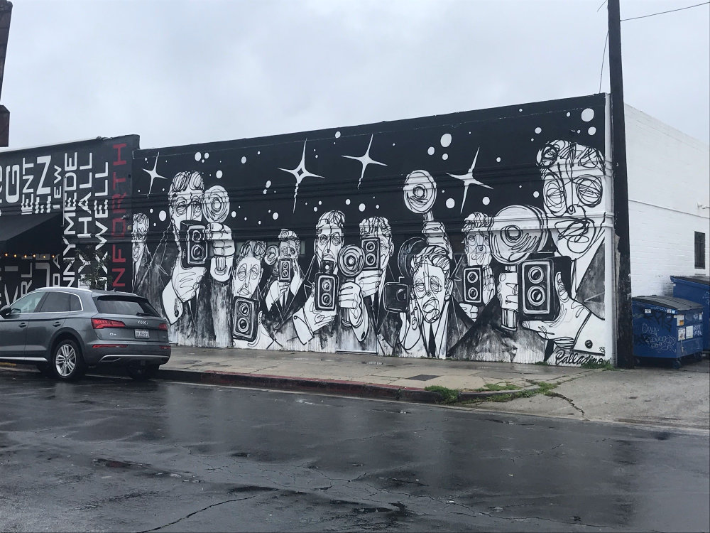 Stephen Palladino black-and-white crowd mural at 7605 Beverly Blvd