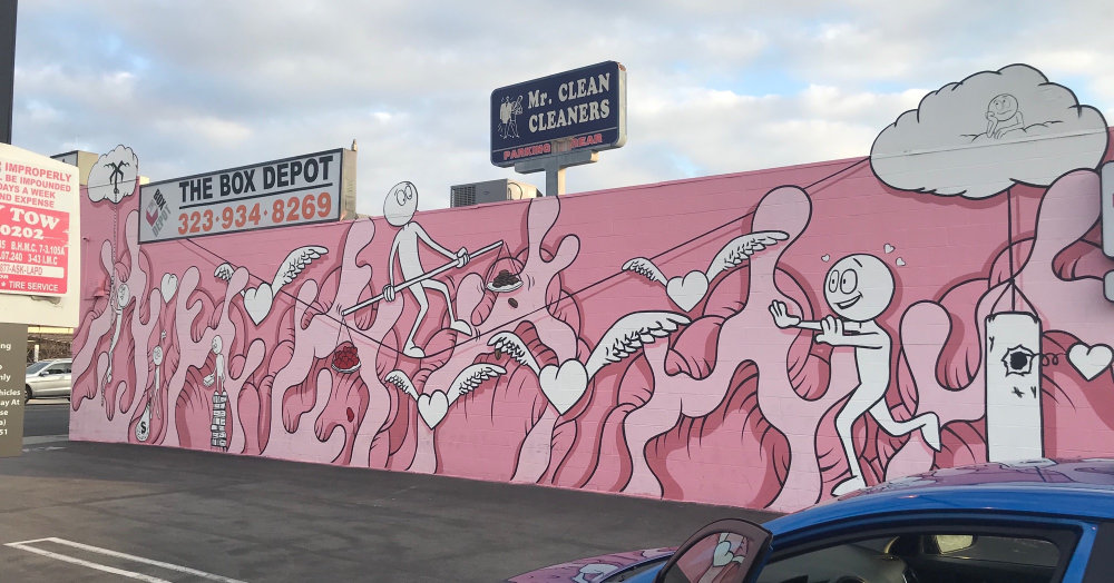 Kai Guetta pink mural with white character figures at 125 N Fairfax Ave