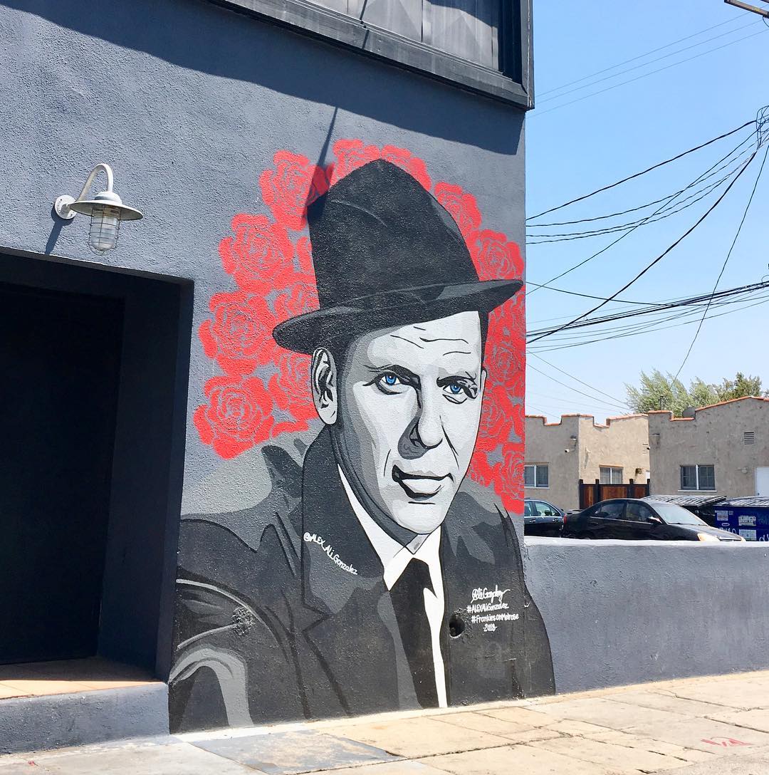 Alex Gonzalez black-and-white portrait mural of a man in a fedora at 672 N Alta Vista Blvd